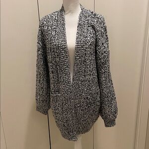 Skies are blue black and white cardigan size M